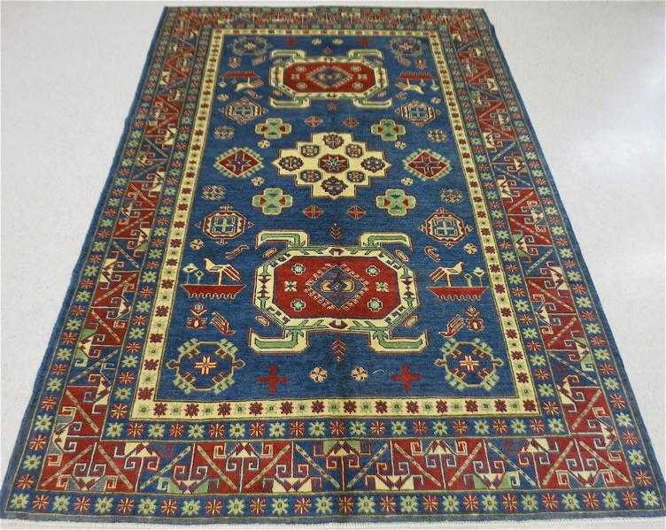 Appraisal: HAND KNOTTED ORIENTAL CARPET Pakistani-Caucasian double geometric turtle medallions and