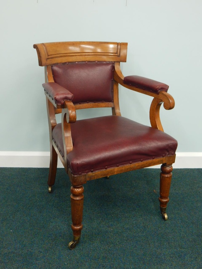 Appraisal: A Victorian oak open armchair with impressed rounded marks for