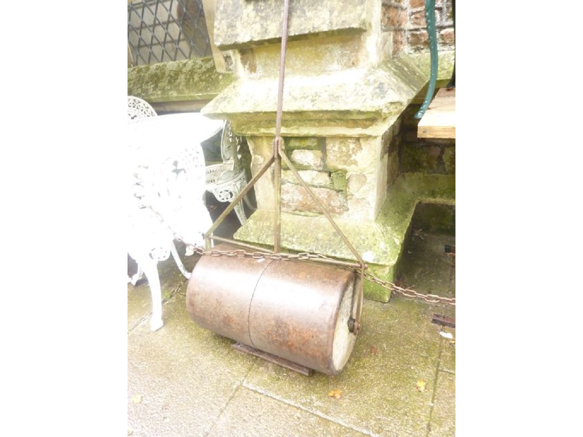 Appraisal: A vintage cast and wrought iron garden roller with T