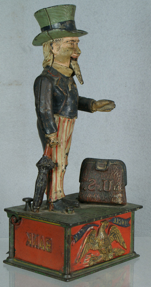 Appraisal: Uncle Sam cast iron mechanical bank some chips and minor