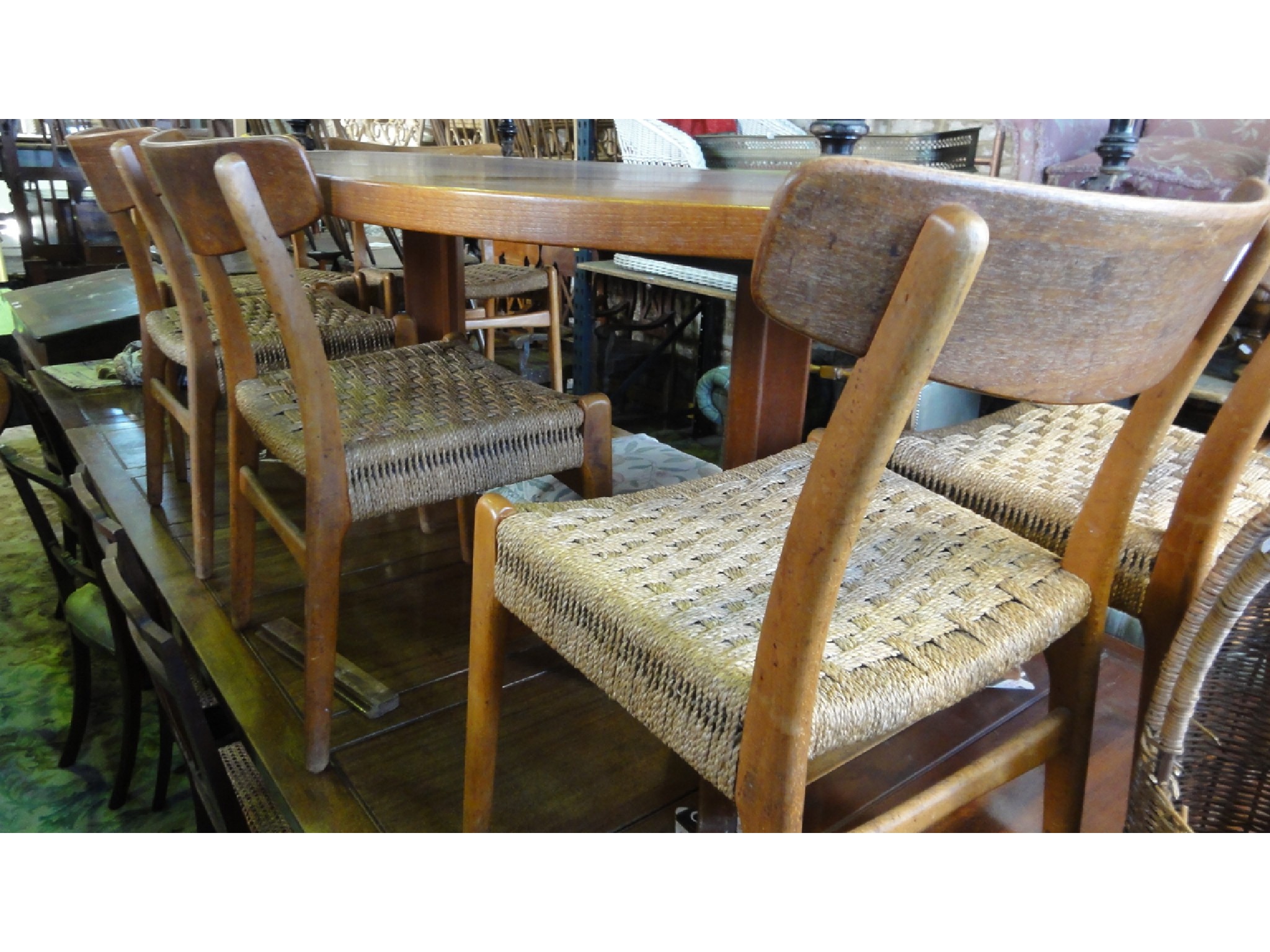 Appraisal: A set of six mid th century teak framed dining