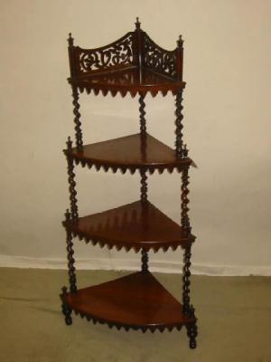 Appraisal: A VICTORIAN ROSEWOOD WHATNOT of four tier quadrant form with