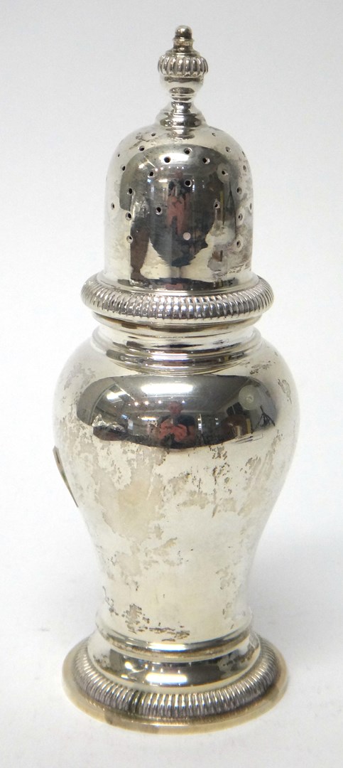 Appraisal: A silver sugar caster of inverted pear shaped form decorated