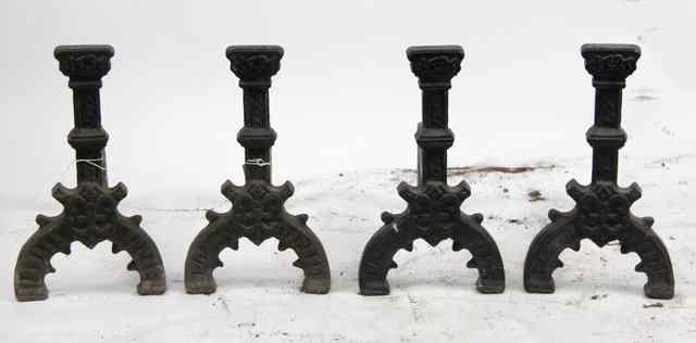 Appraisal: Two pairs of fire dogs with silhouette baluster supports cm