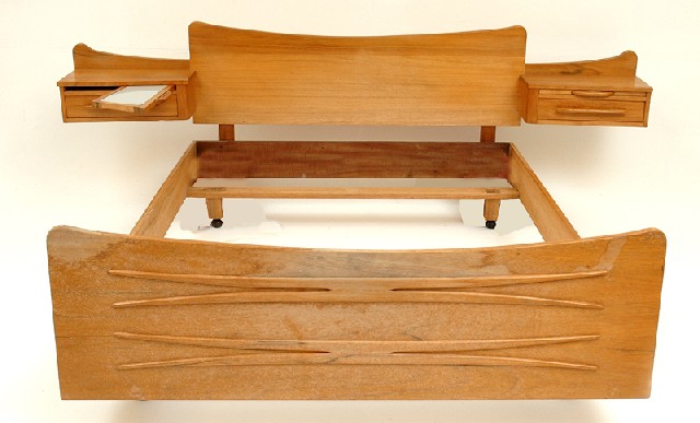 Appraisal: A SCHULIM KRIMPER TEAK BED Signed circa The shaped head