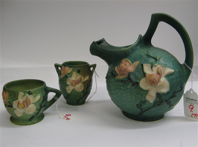 Appraisal: SEVEN PIECES ROSEVILLE POTTERY in the Magnolia pattern cider pitcher