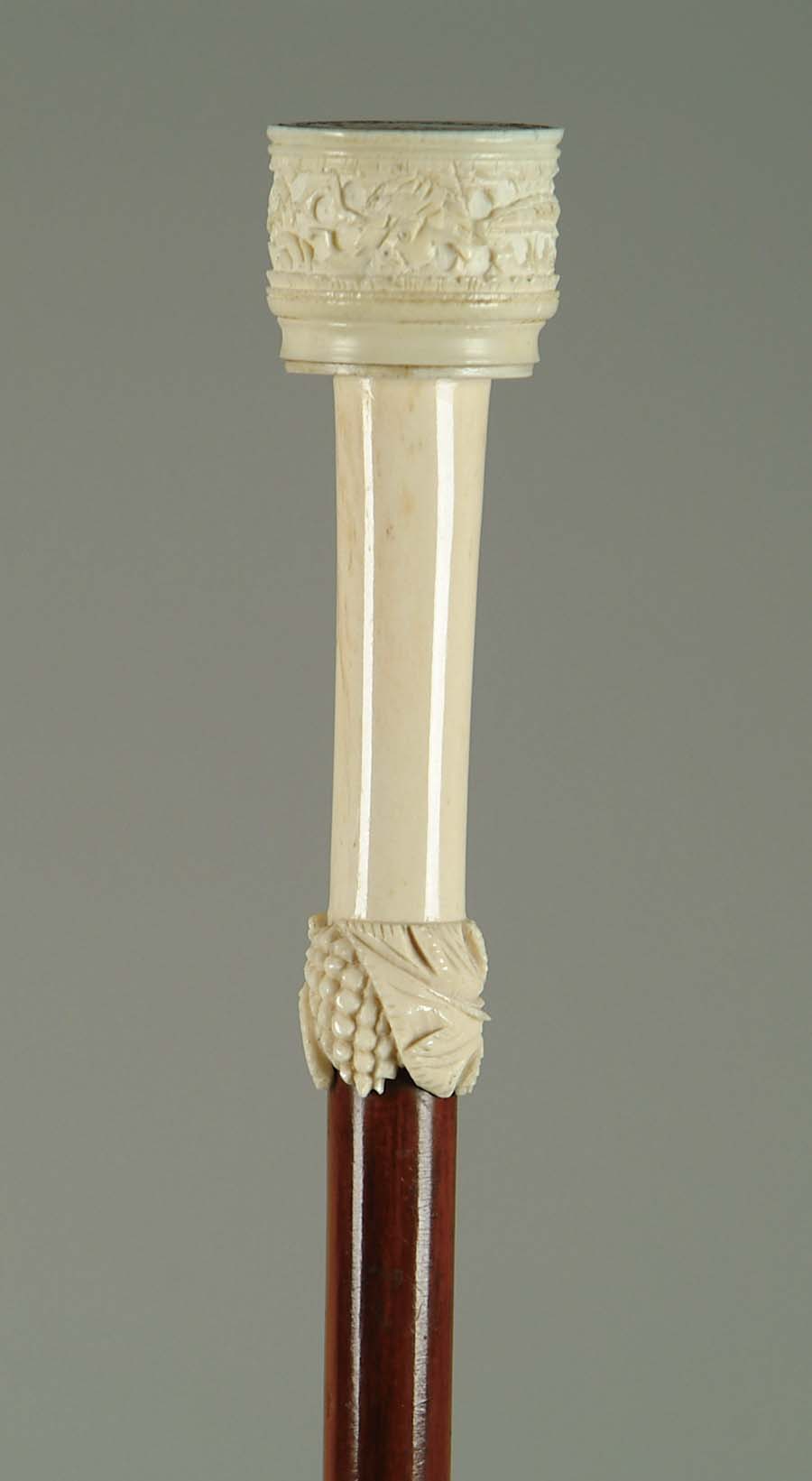 Appraisal: CANE CARVED IVORY SILVER DOLLAR CANE The carved ivory handle