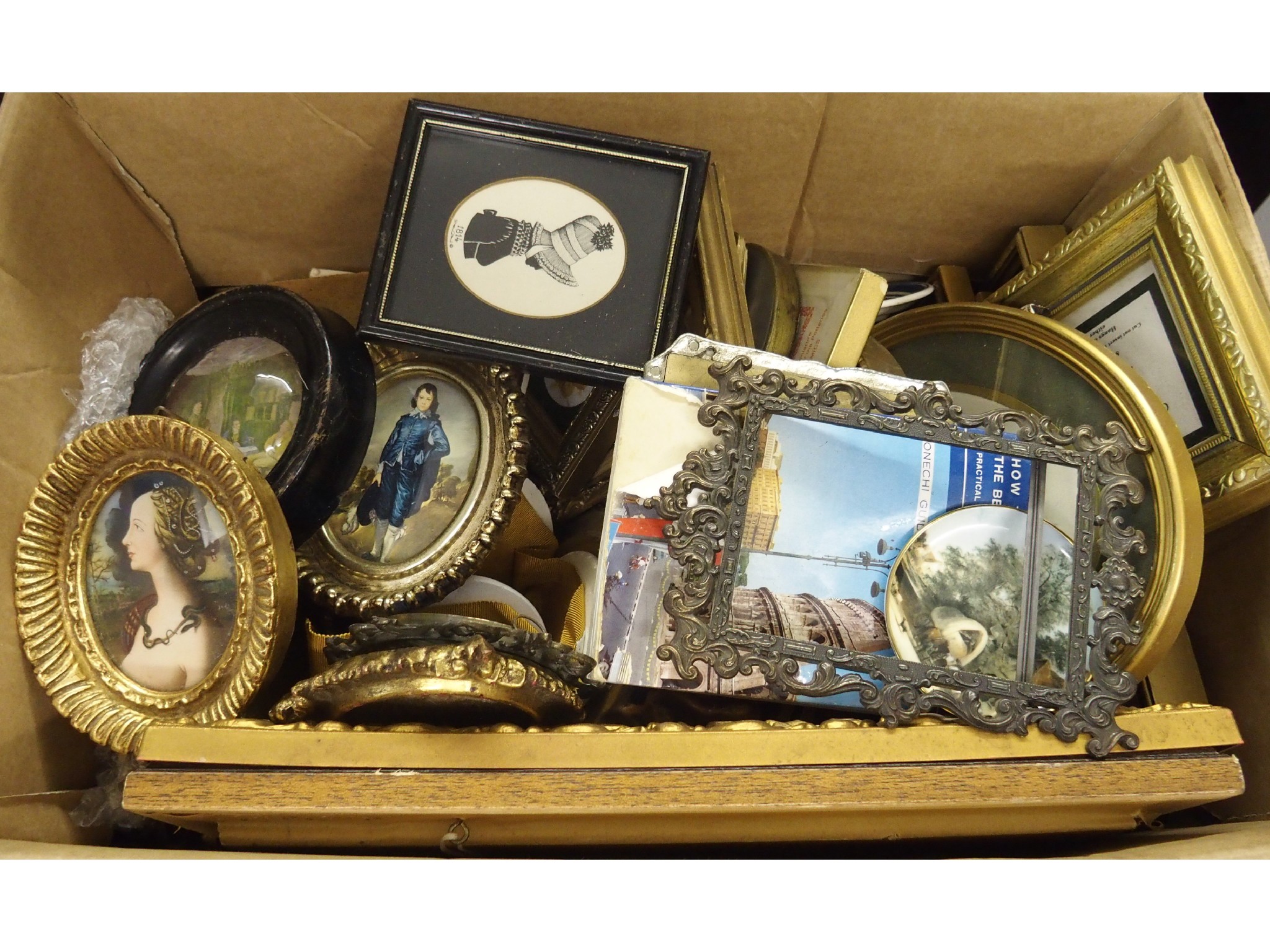 Appraisal: A box of gilt and metal framed miniatures