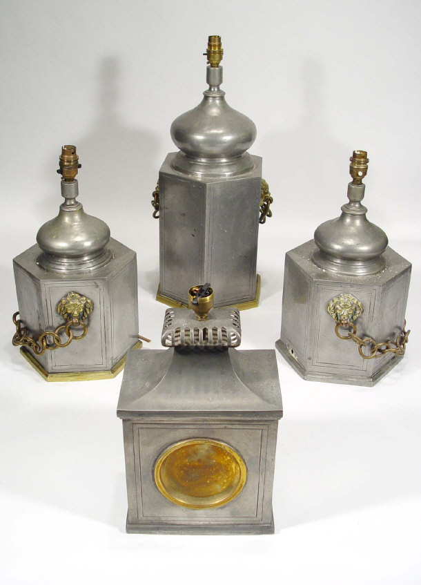 Appraisal: Continental pewter three piece lamp garniture with brass lion masks