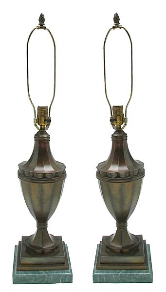 Appraisal: A pair of patinated metal lamps height in