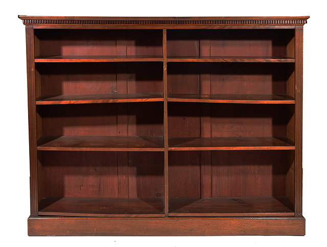 Appraisal: A VICTORIAN MAHOGANY BOOKCASE with dog tooth carved cornice and