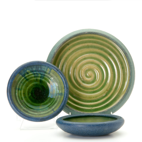 Appraisal: GRUEBY Three low bowls two in indigo one in blue-green