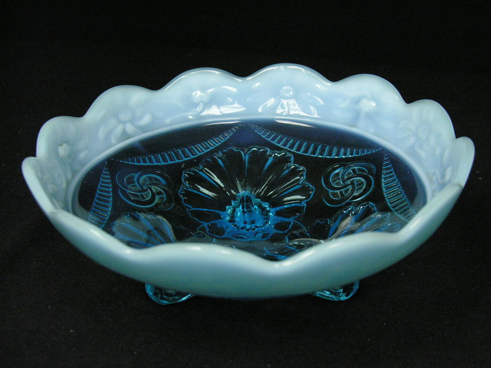 Appraisal: BLUE OPALESCENT FOOTED BOWL Size with diameter