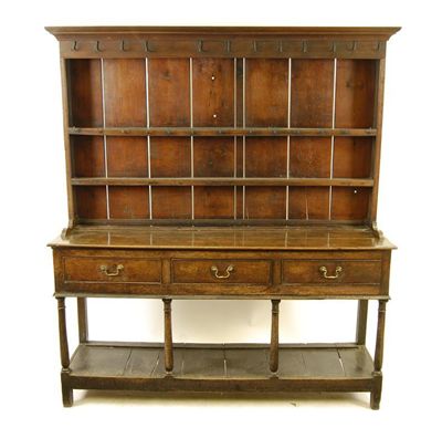 Appraisal: An early th century oak dresser with a shelved back