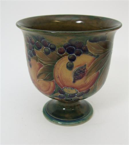 Appraisal: MOORCROFT POTTERY FOOTED VASE CIRCA of cylindrical form with everted