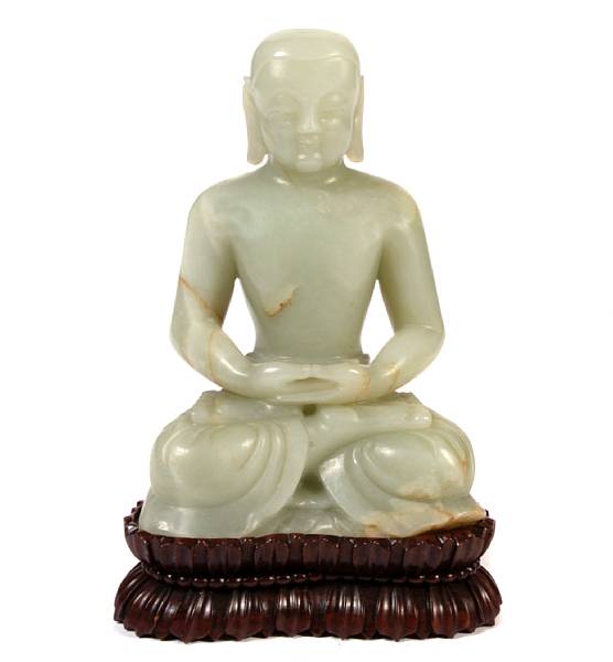 Appraisal: A Chinese carved nephrite figure of a seated Buddha th