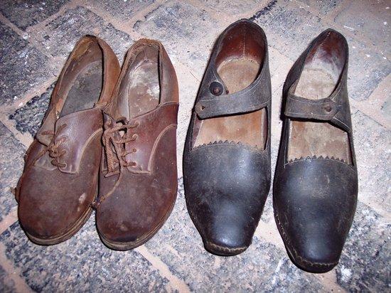 Appraisal: A pair of ladies' leather clogs with wooden soles and