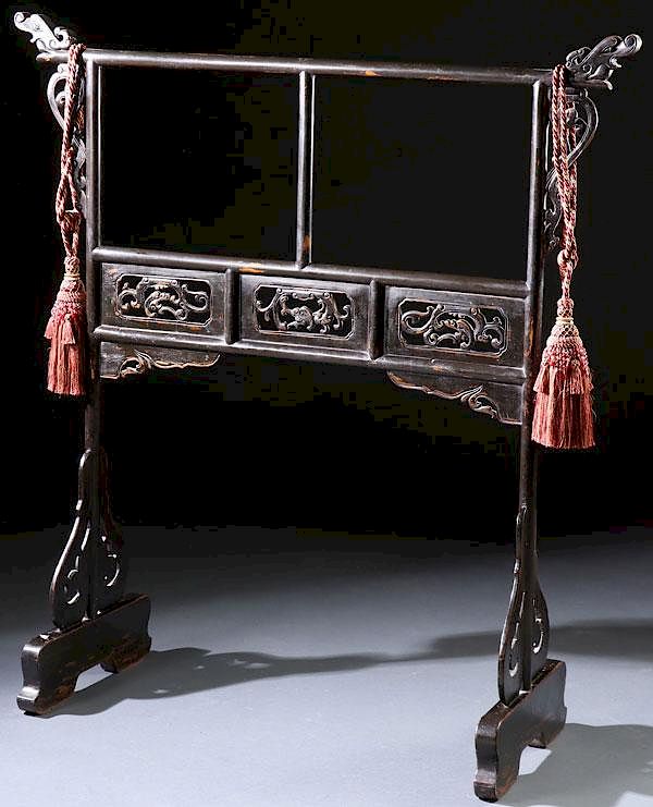 Appraisal: A CHINESE CARVED AND EBONIZED GARMENT STAND A CHINESE CARVED