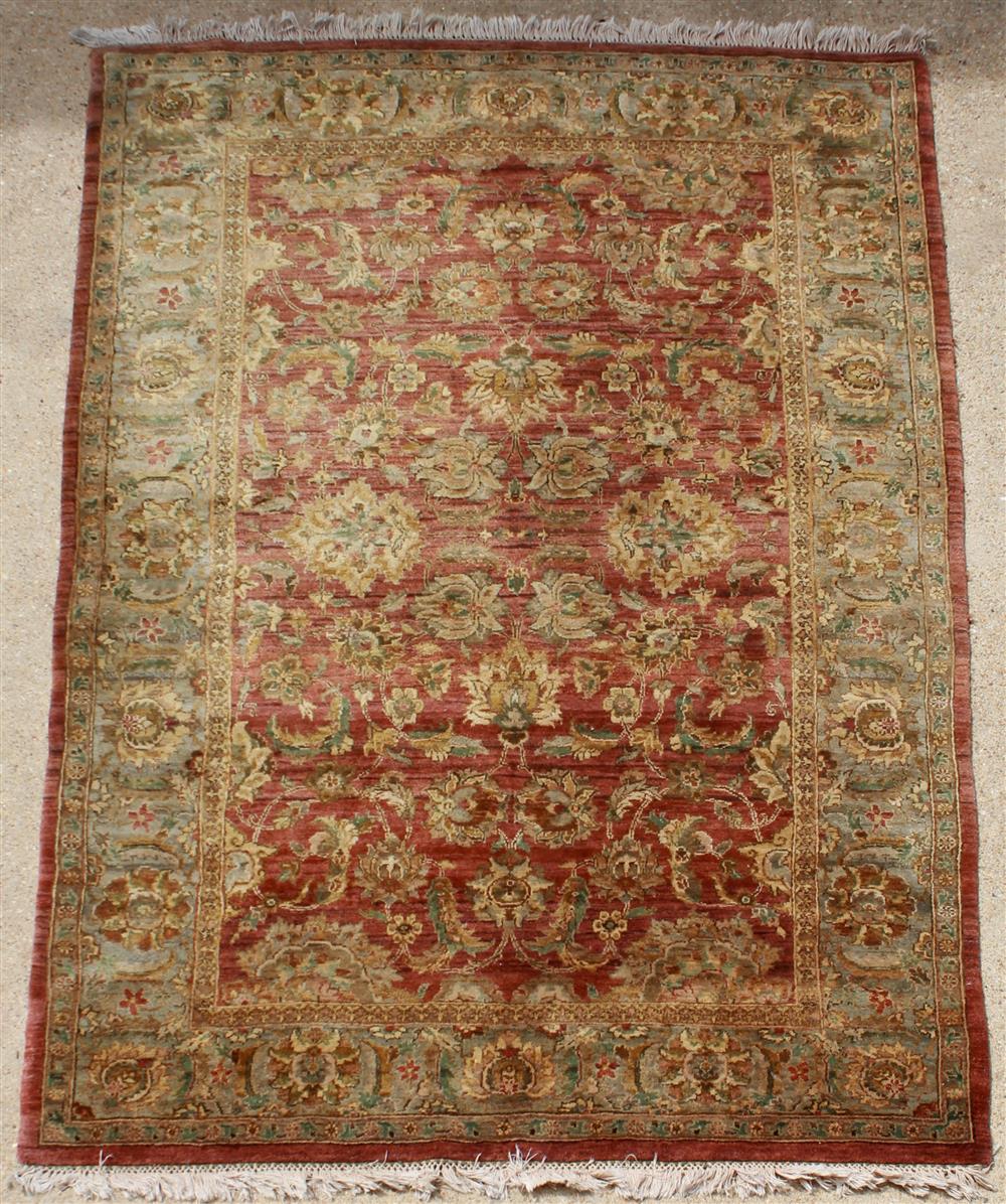 Appraisal: INDO PERSIAN FLORAL WOOL RUG with scrolling flowers on brick