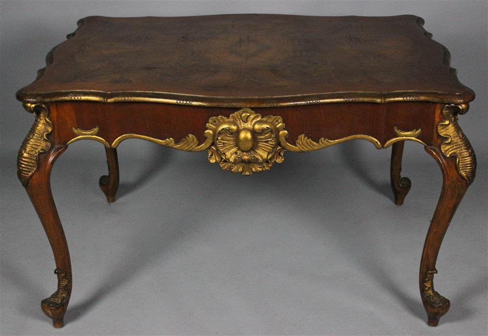 Appraisal: CONTINENTAL ROCOCO STYLE PARCEL GILT QUARTER VENEERED WALNUT CENTER TABLE