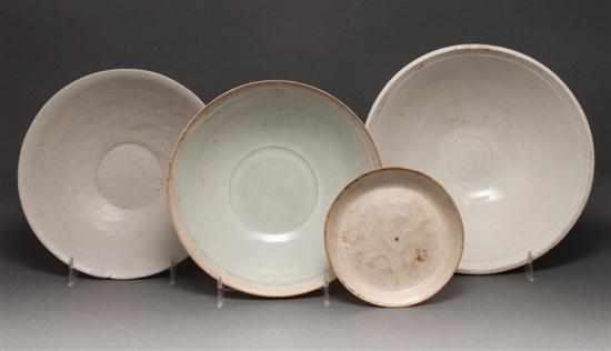 Appraisal: Four Chinese white glaze stoneware and earthenware bowls th- th