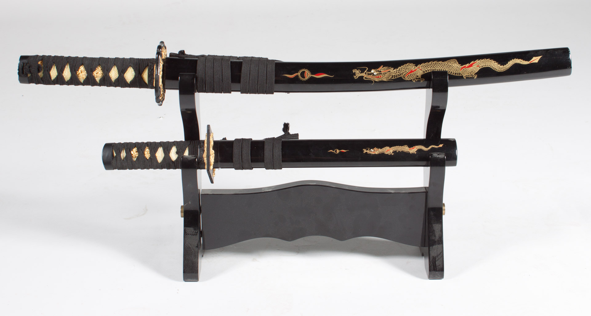 Appraisal: Set of Reproduction Samurai Swords Stand Set of two reproduction