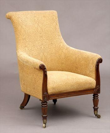 Appraisal: REGENCY UPHOLSTERED MAHOGANY BERGERE The slant back above upholstered arms