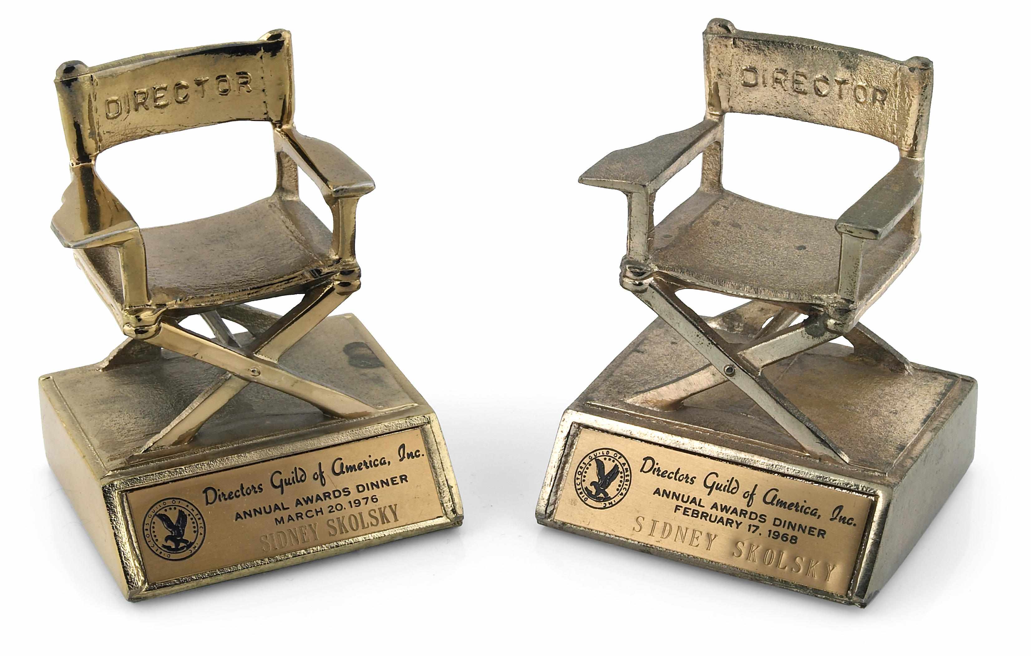 Appraisal: Director's Guild awards dinner statuettes A pair of metal statuettes