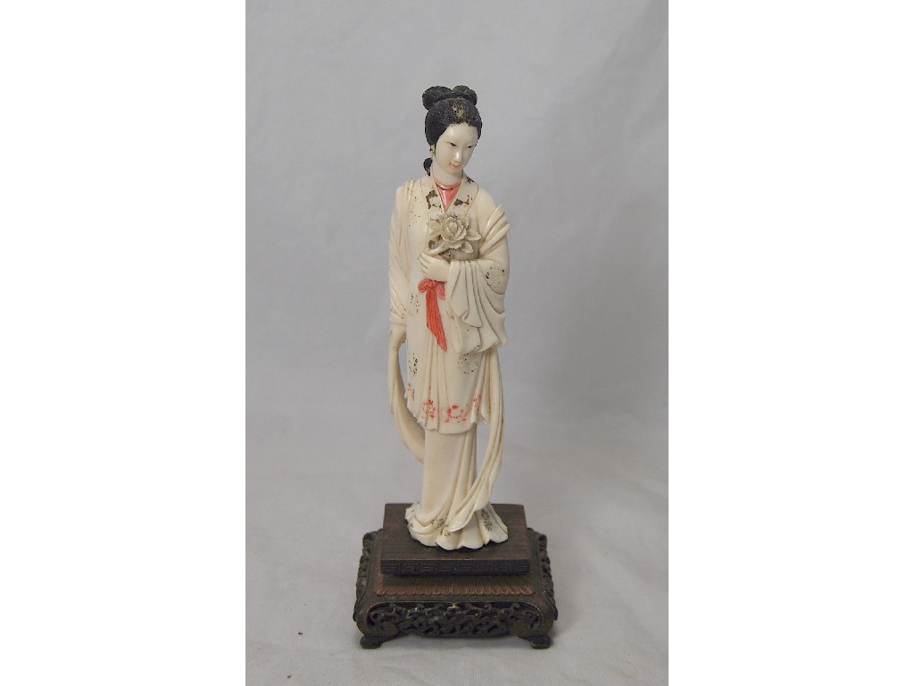 Appraisal: A Chinese carved and painted ivory figure of an elegant