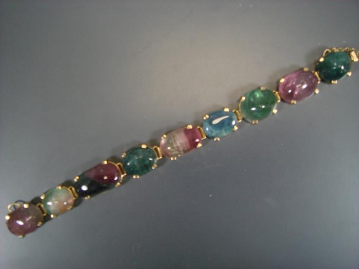 Appraisal: K YG bracelet set with various colored cabochon stones Estimate