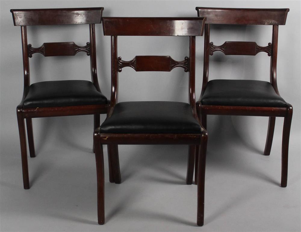 Appraisal: THREE CLASSICAL STYLE MAHOGANY SIDE CHAIRS WITH BLACK PEBBLE LEATHER