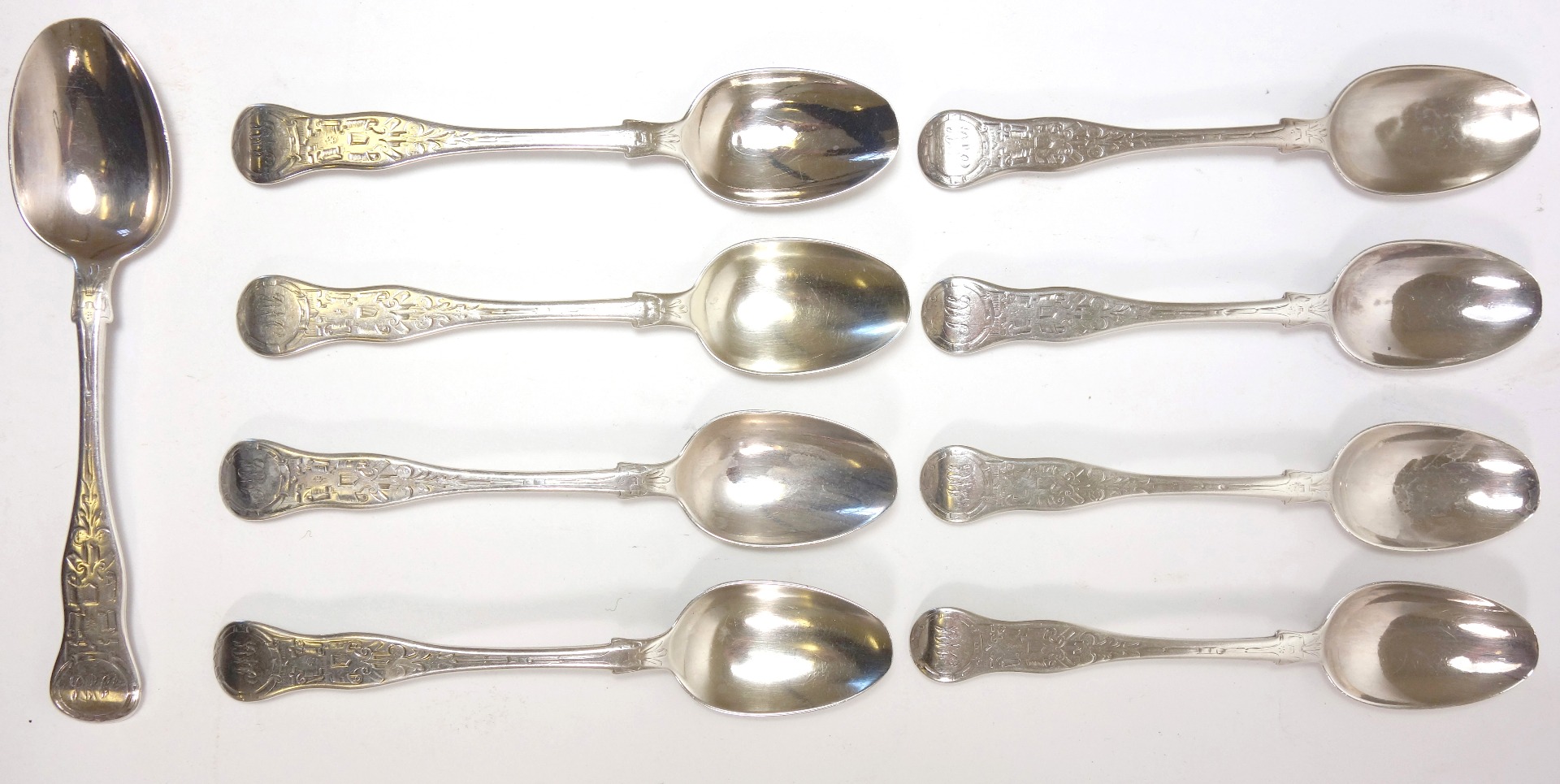 Appraisal: A set of nine Victorian silver engraved hourglass shape teaspoons