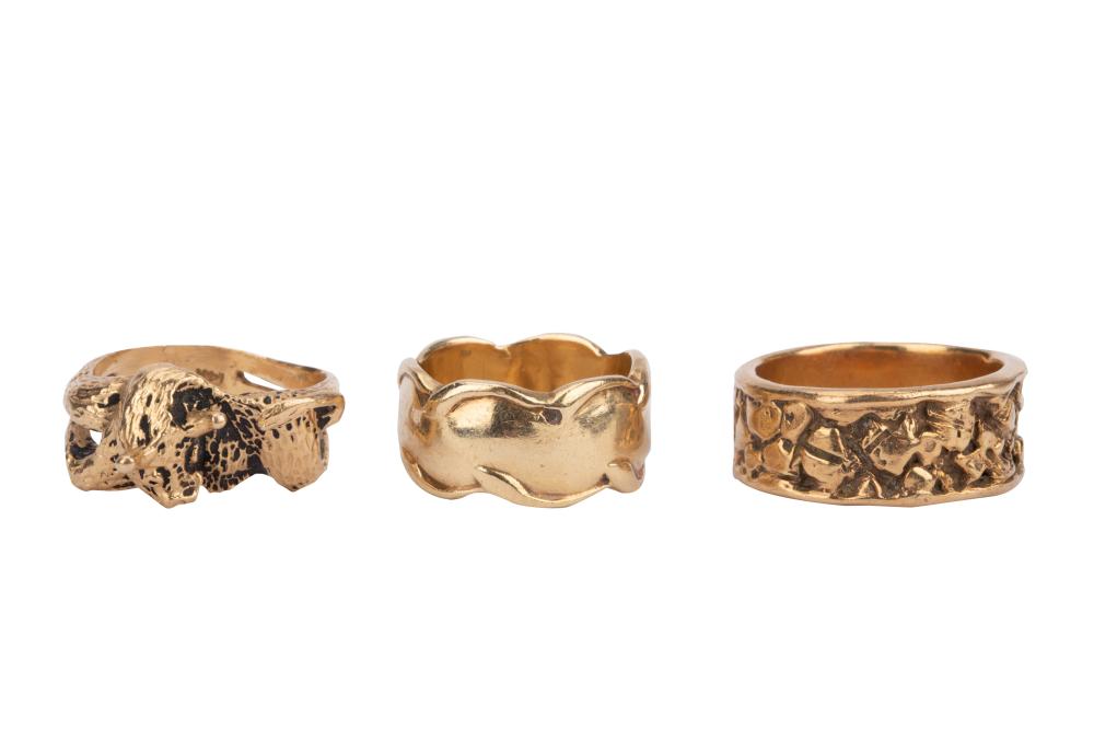 Appraisal: THREE KARAT YELLOW GOLD RINGScomprising one band with cow motif