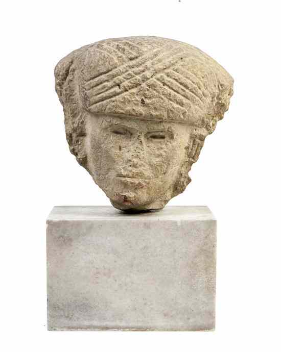 Appraisal: An Aztec Limestone Bust depicting a male with stylized hair