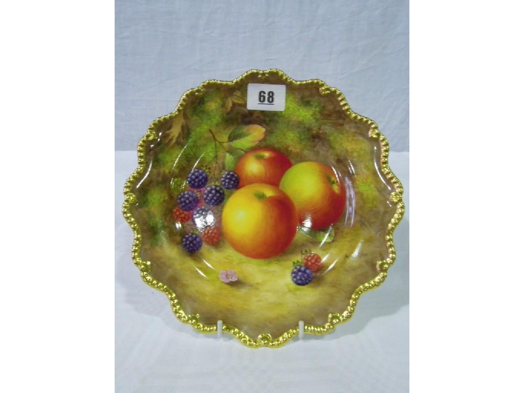 Appraisal: A Royal Worcester plate decorated with fruit signed H Aynton