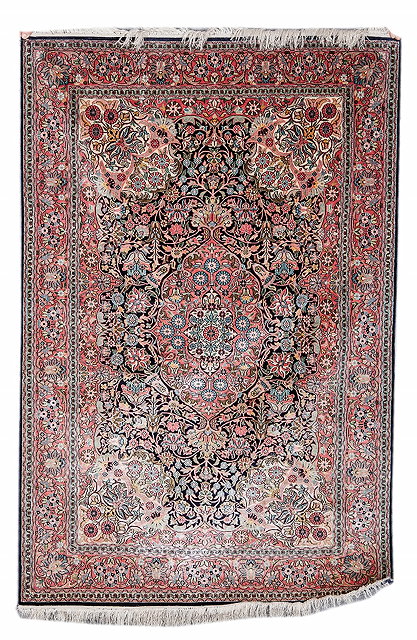 Appraisal: A PERSIAN QUM SILK RUG with a central foliate medallion