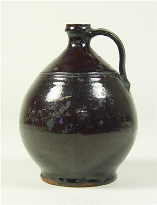 Appraisal: Ovoid Earthenware Jug th Century Early form with brown glaze