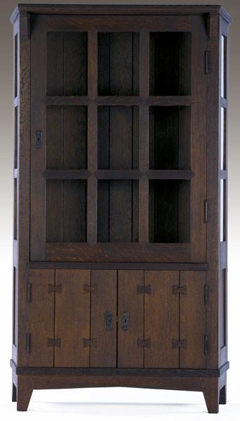 Appraisal: GUSTAV STICKLEY Early trapezoidal china cabinet no with mitered mullions