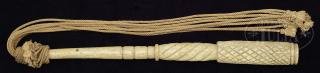 Appraisal: CARVED WHALEBONE CAT-O-NINE TAILS Fashioned with nine hemp tails with