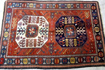 Appraisal: A KAZAK RUG the red field with two large octagons