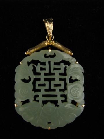 Appraisal: K yellow gold hand carved light green jade enhancer pendant