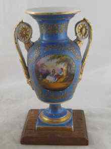 Appraisal: A two handled vase on a square foot with a