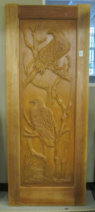 Appraisal: PICTORIAL CARVED TEAKWOOD ENTRY DOOR Doorcraft Ltd Bronkhorspruit South Africa