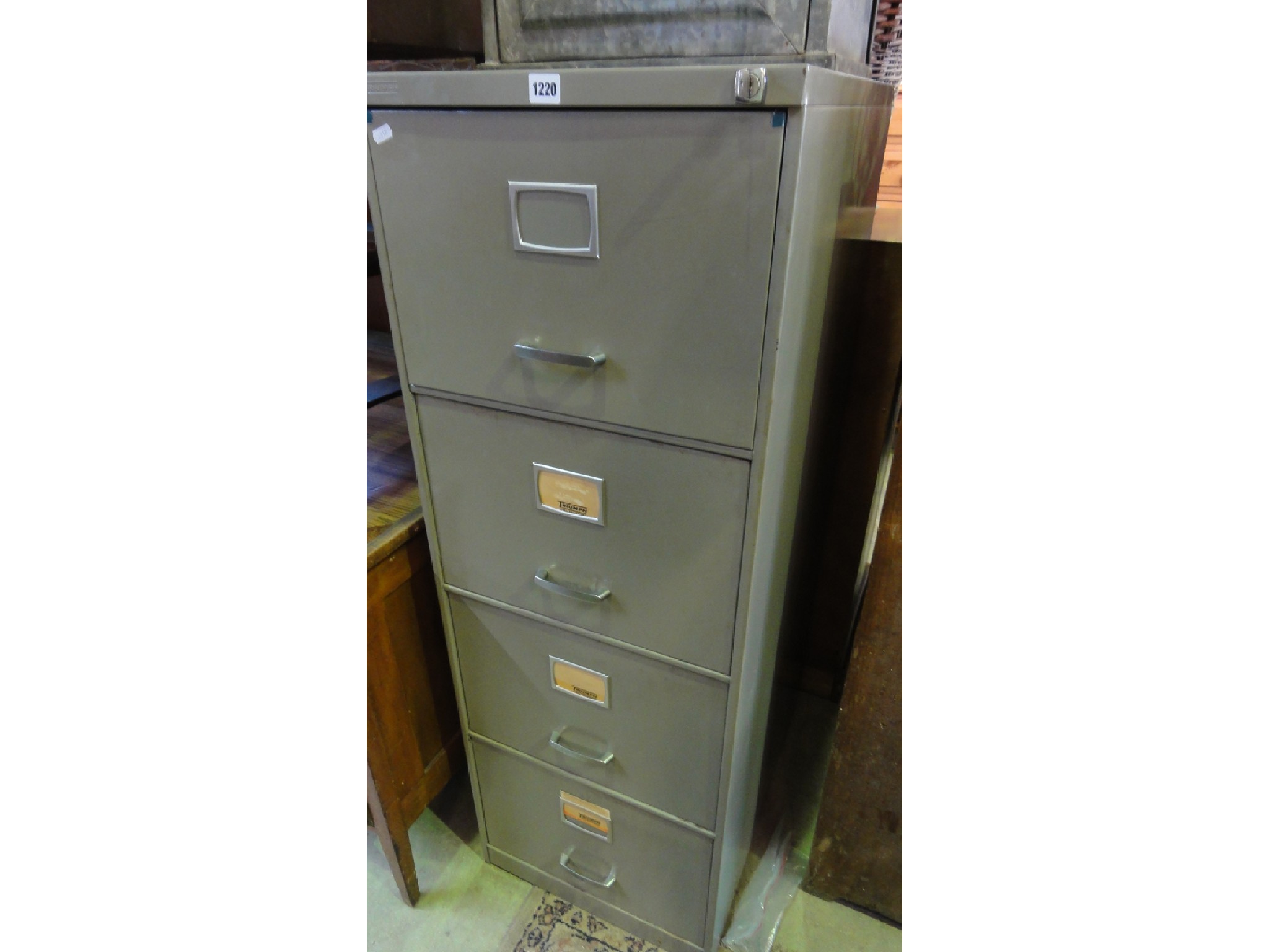 Appraisal: A Triumph four drawer steel filing cabinet complete with key