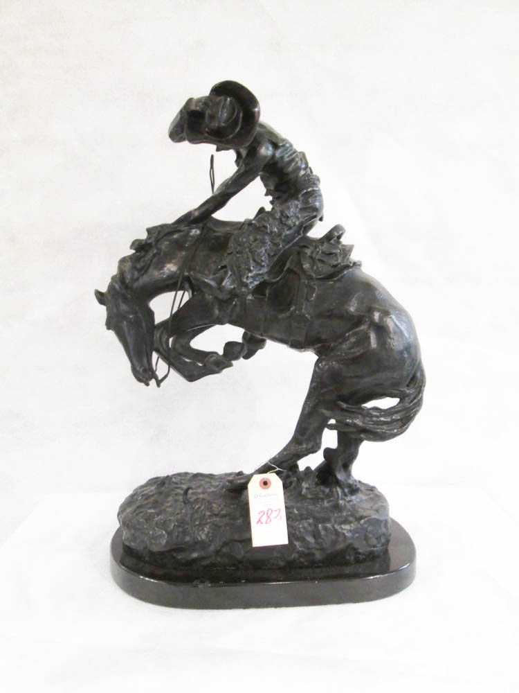 Appraisal: AFTER FREDERIC REMINGTON American - Rattlesnake bronze sculpture raised on