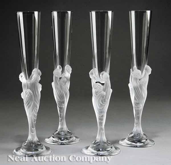 Appraisal: A Group of Four Flute Majestique Lead Crystal Champagne Flutes