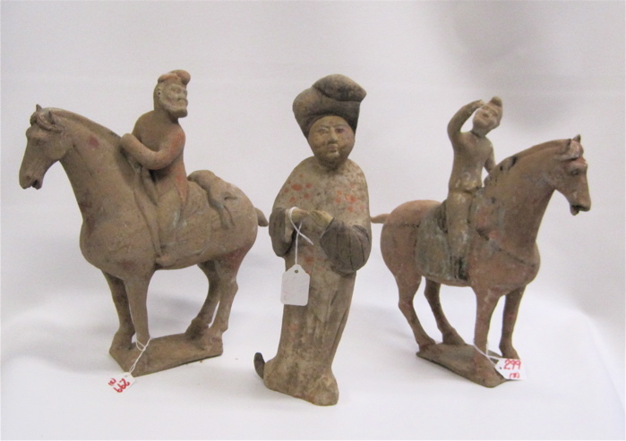 Appraisal: THREE CHINESE POTTERY FIGURES man mounted with hare over back