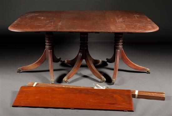 Appraisal: George IV mahogany three-part pedestal dining table with four extension