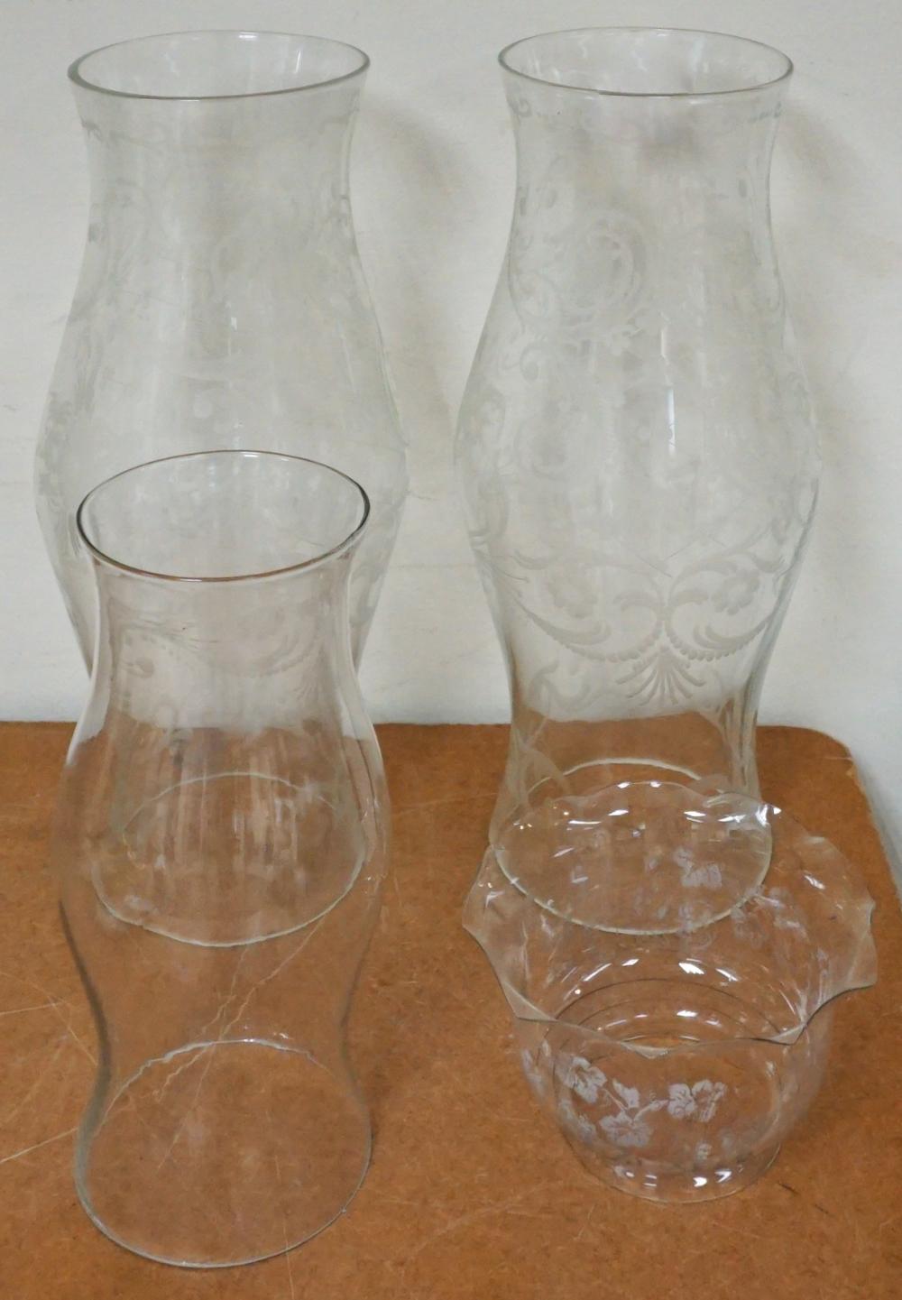 Appraisal: PAIR OF ETCHED GLASS HURRICANE SHADES A SINGLE GLASS HURRICANE