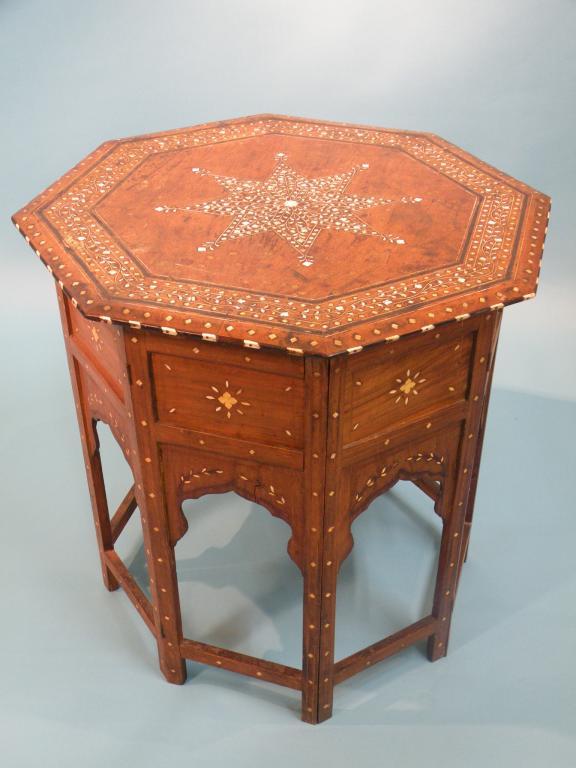 Appraisal: A middle eastern hardwood and bone inlaid octagonal table in